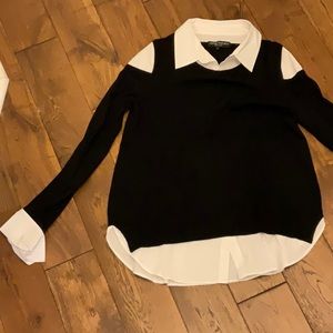 Black sweater with white shirt detail